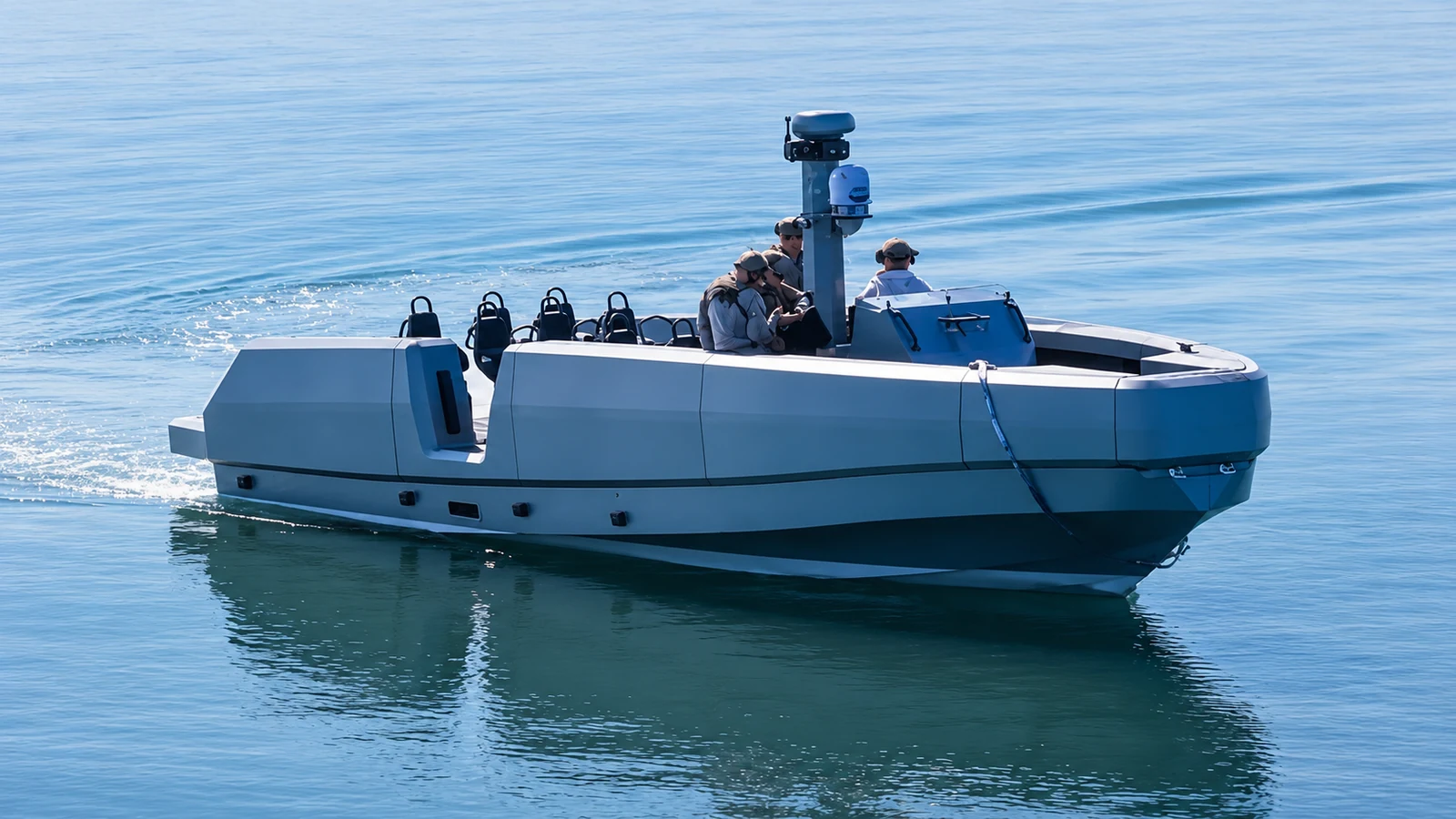 Modern combatant craft underway with integrated mission-system mast